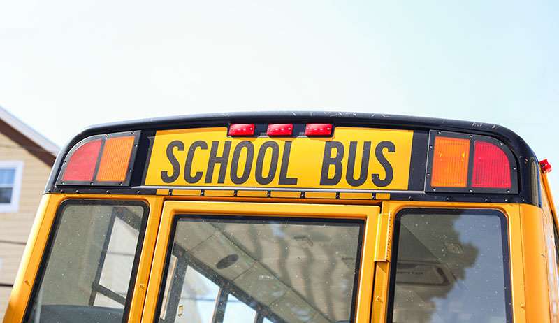 The back of a yellow school bus