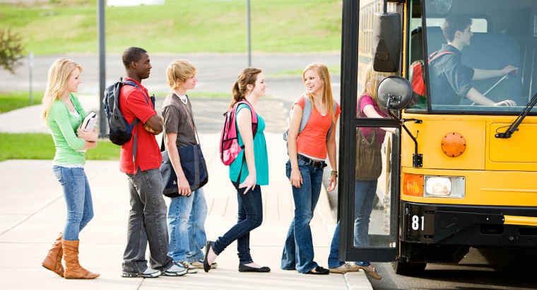 Students boarding a school bus