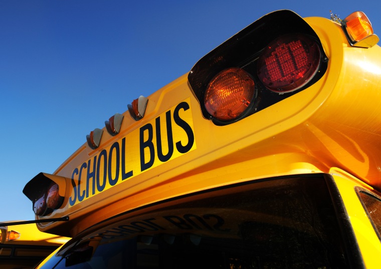The front of a yellow school bus